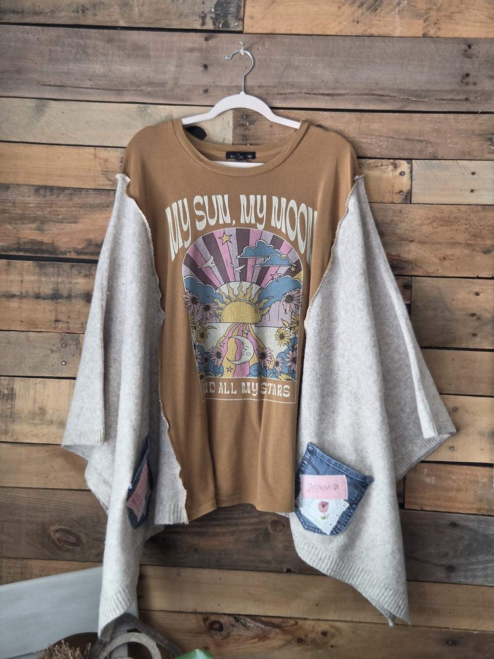 Upcycled Graohic T-shirt With Cream Sweater Sleeves.